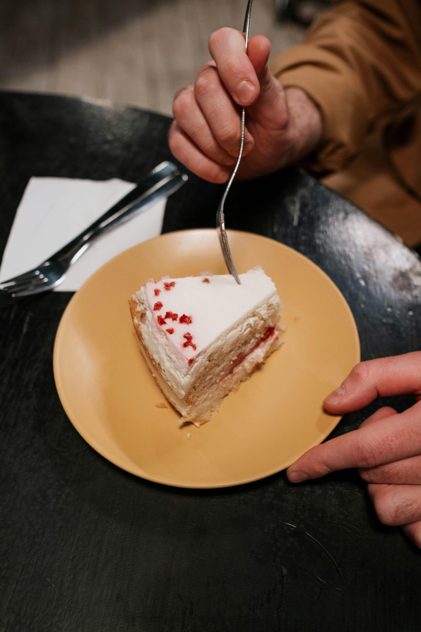 pexels photo 8442223 8442223 A tempting slice of cake on a plate with a fork ready to taste.